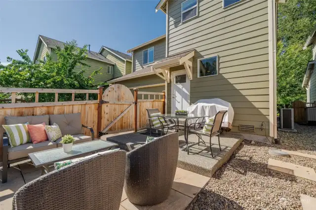 Extended back patio is low maintenance and great for entertaining. Connected BBQ Grill conveys.