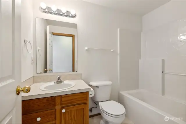 The main full bathroom serves the two bedrooms, and has waterproof vinyl flooring for ease of care and maintenance.