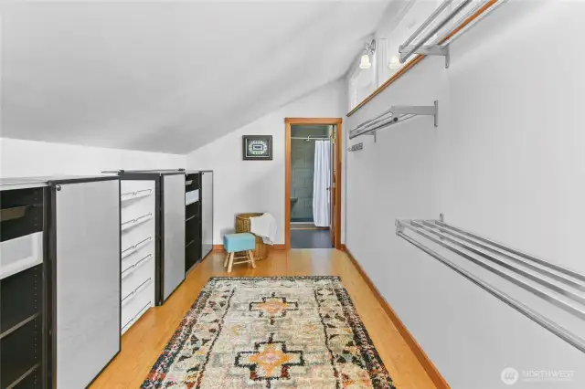 Walk through closet hallway to master bath