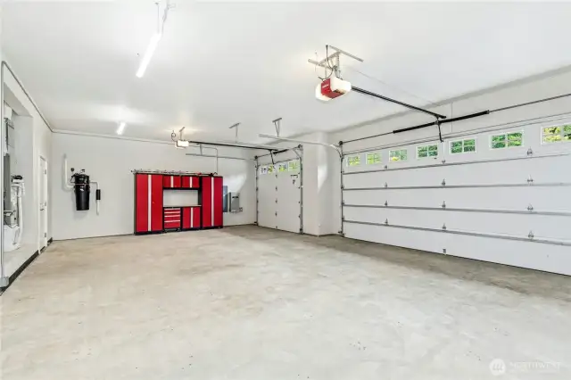 Very big 3-car garage. Central Vac motor is on back wall to left of storage unit