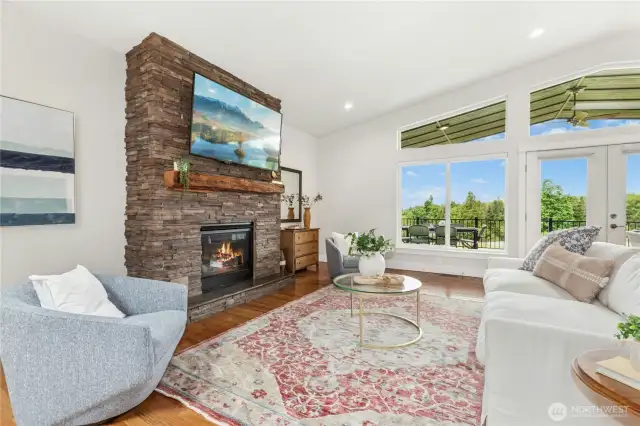 Propane fireplace and wall of windows facing NW