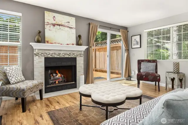 Spacious living room with abundant natural light pouring through oversized windows, creating a bright and welcoming environment for relaxing or entertaining guests.