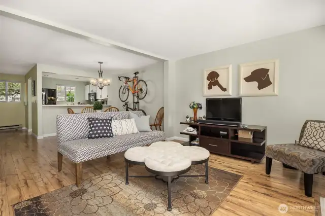 A cozy wood-burning fireplace anchors the living space, offering warmth and ambiance during colder months or quiet evenings at home.