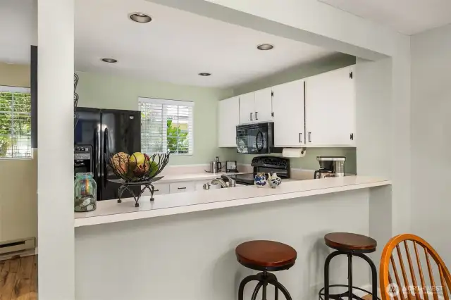 Brightly lit by a nearby window or sliding door, the area enjoys natural light throughout the day, enhancing mealtime ambiance.