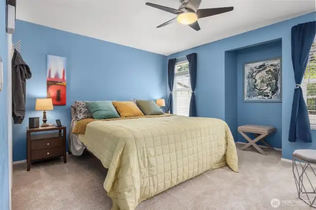 Large windows invite natural light while maintaining privacy, creating a restful and rejuvenating atmosphere.