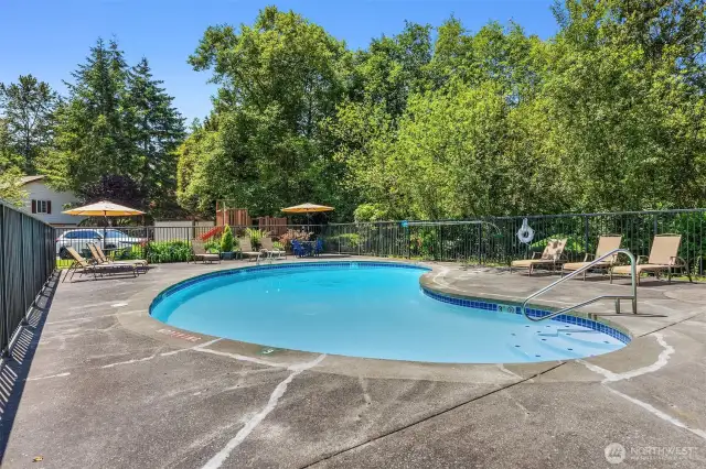 Surrounded by a secure fence and comfortable seating, the pool area ensures both safety and comfort for individuals and families alike.
