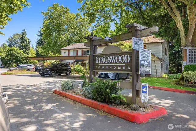 The front entrance features a sturdy door with modern hardware, offering peace of mind and curb appeal. A small overhang shields you from the weather.