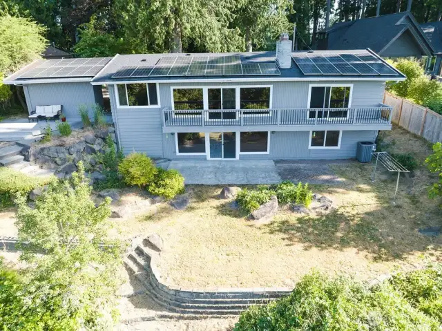 View of backyard, patio, and 2 decks to entertain.