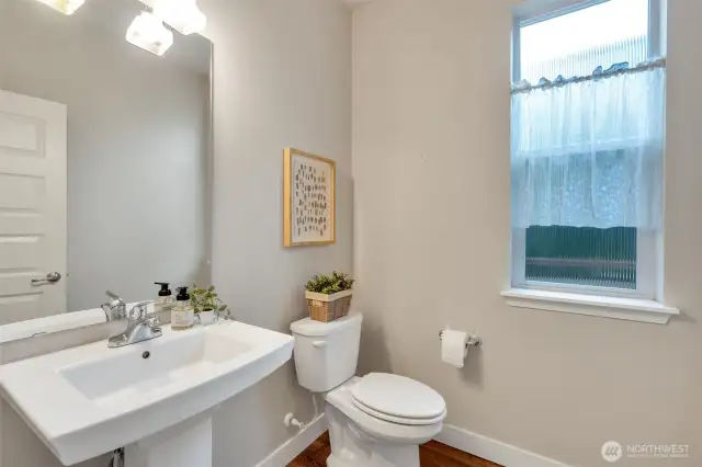 A pretty powder room conveniently located on the main level.