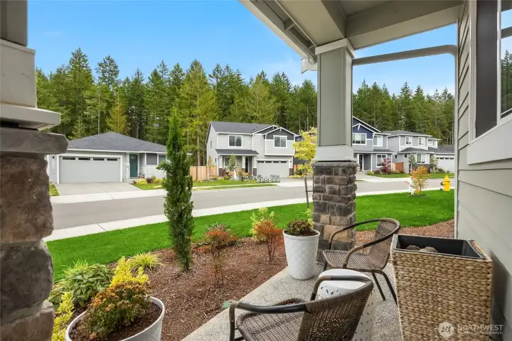 Charming front porch to sit and chat with friends and neighbors.