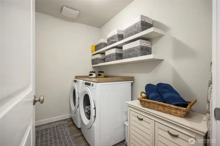 Upstairs laundry room is a MUST when you have the bedrooms upstairs. Plumbed for a sink where the little storage chest is.