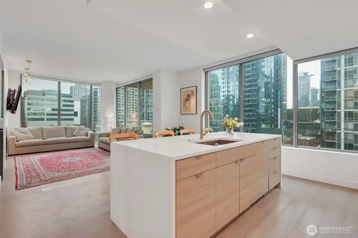 Welcome home to the convenience of city living and city views! Floor to ceiling windows with motorized blinds, laminate flooring.