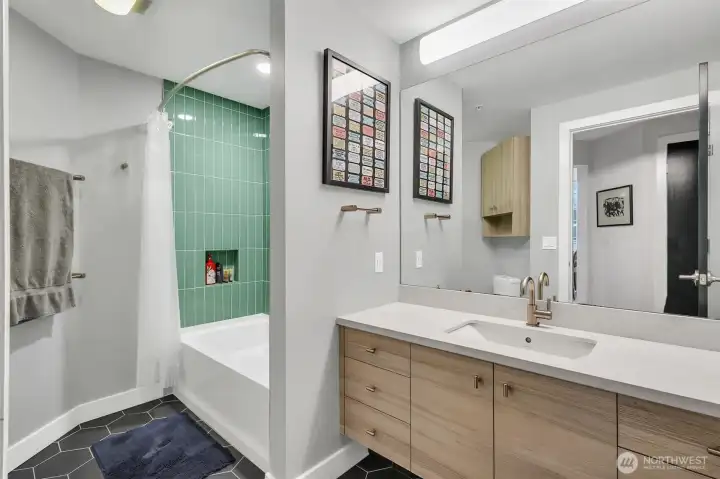 Looking into the hall bathroom. Floating vanity makes the space so modern and more color!
