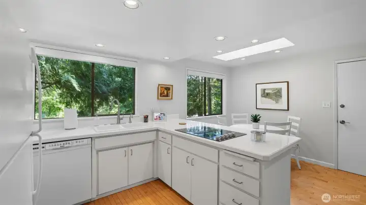 Dine with nature as your backdrop thanks to expansive windows framing lush greenery.