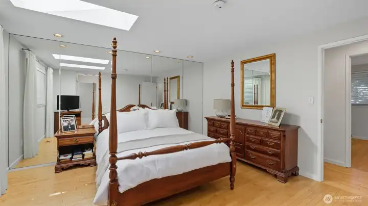 Make this inviting primary suite your personal sanctuary with hardwood floors and striking mirrored accents!