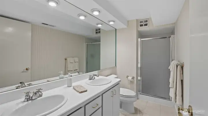 Conveniently located lower-level full bath ideal for guest use.