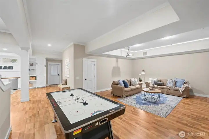 A full-footprint, fully-finished basement with separate entrance maximizes livability and function.  Air hockey table conveys with the home unless otherwise requested.