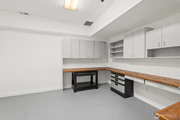 A second, large workshop space in the basement keeps your messy projects isolated from the rest of your living space without relegating you to the garage.  This room is ready for whatever you want to create, fix, repair or mend.
