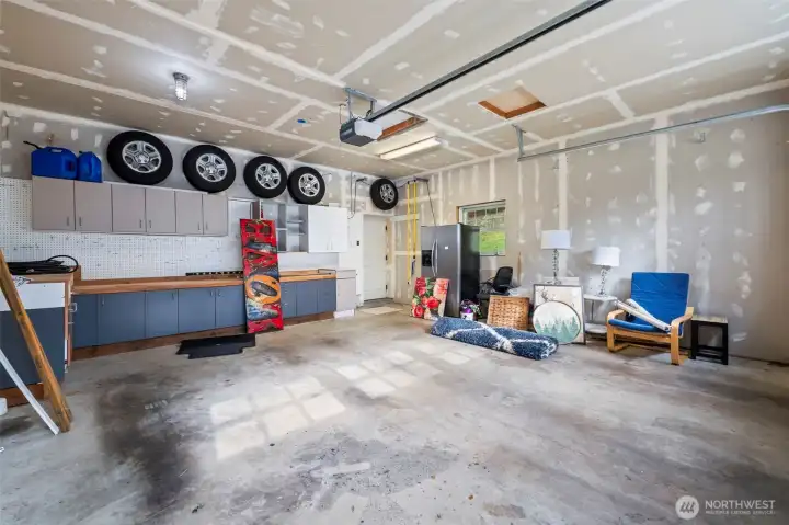 If your hobbies include working on things that drive or float, this garage has all the built-in storage you'll need.