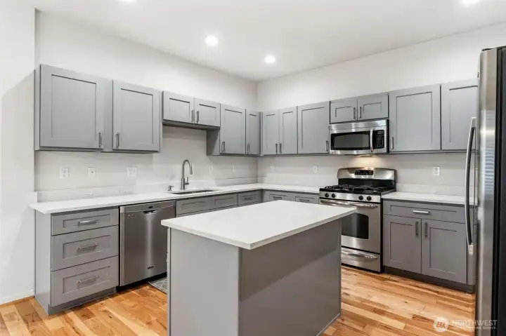 Quartz counter tops and beautiful cabinets