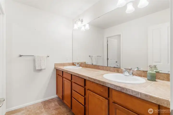 Dual sinks in primary suite bathroom