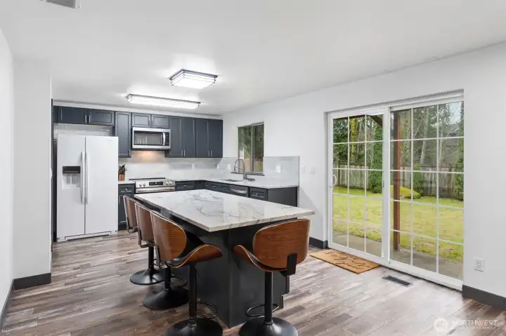 Updated kitchen with natural stone countertops