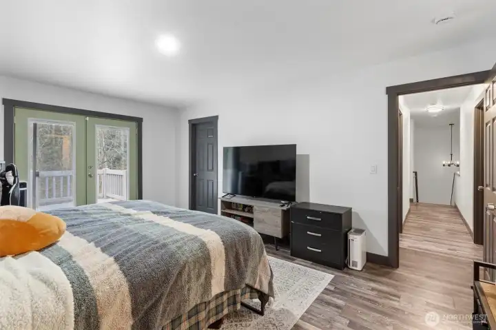 Primary bedroom leading out to own deck