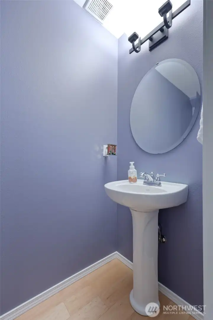 Classy 1/2 bath is available on main level for guests.