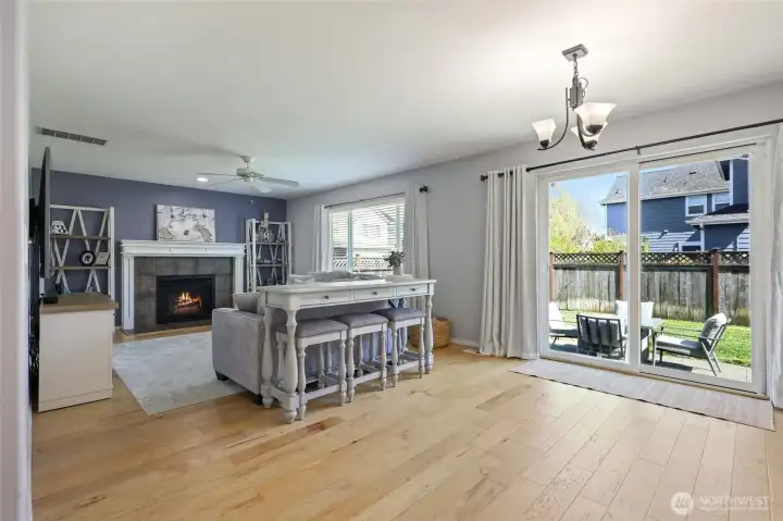Appealing light wood floors and open design makes this main living space inviting and practical--a beautiful area for life to take place!