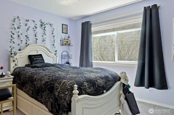 Third bedroom along south side of house; enjoy the blooming tree as your view, not a neighbor's window!