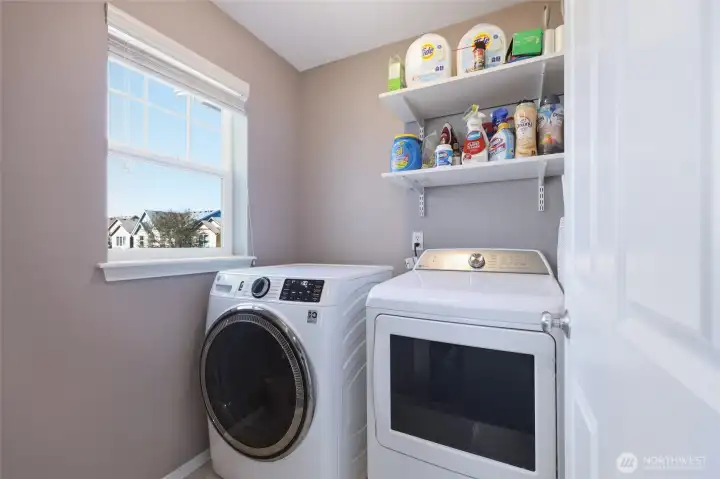 Dedicated laundry room upstairs for ease and convenience!  Window provides natural light, and you can simply tuck it all behind a closed door if desired.