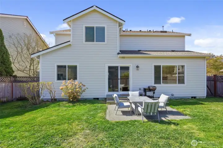 Patio off slider provides space for dining, BBQ, firepit.