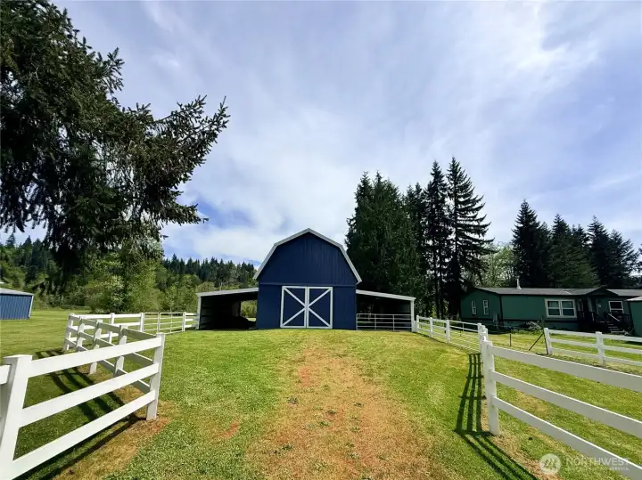 24x36 barn featuring a loft, two existing horse stalls with room to add more, and 14-ft lean-tos on each side.