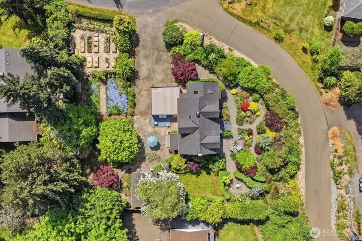 Bountiful fruit trees, waves of color, year-round blooms, raised beds, & ever-changing landscapes are all yours to enjoy.