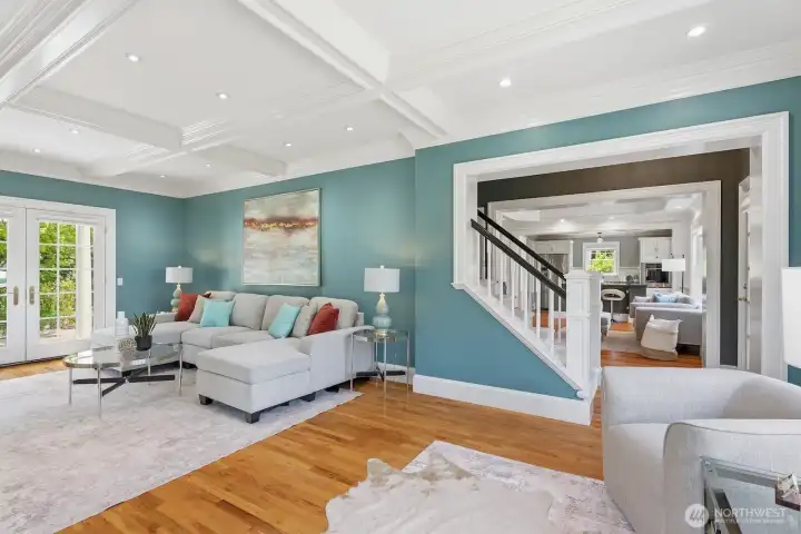 Coffered ceilings, hardwood floors, and tons of built-in shelves give nods to this home's mid-century roots.