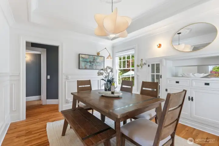 Pull up a chair, there's room for everyone at the table in this bright and cheery dining room!