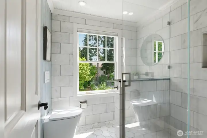 All rooms in this home, including this stylishly remodeled bathroom upstairs, are kept warm and cozy with efficient radiant in-floor heat.