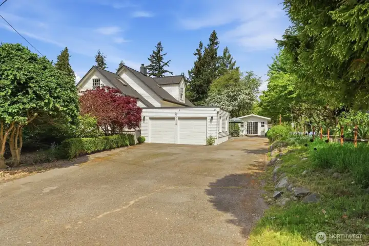 Parking galore! Between the spacious, long driveway and the detached 2-car garage, you have plenty of space here for multiple vehicles plus an RV or boat!