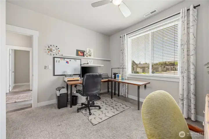Spacious secondary bedroom featuring organized storage, modern finishes, and flexible use for guests, office space, or hobbies.