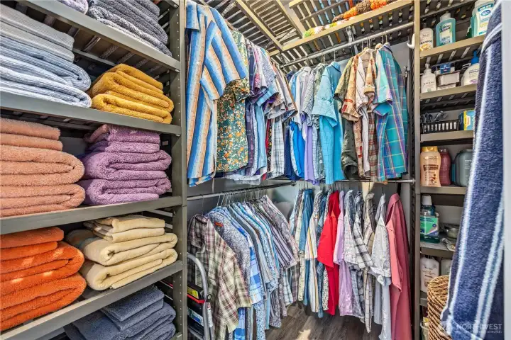 walk-in closet with custom built-ins, shelving, and hanging storage designed for maximum organization and functionality.