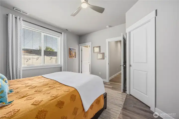 Beautiful primary retreat featuring abundant natural light, custom built-in wardrobe storage, and easy access to spa-inspired ensuite bath.