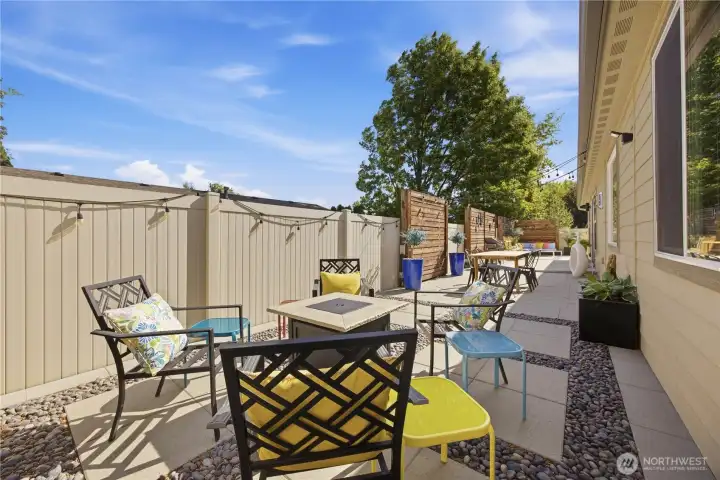 Stunning indoor/outdoor connection with oversized 8-foot sliding door opening to beautifully designed patio and entertaining spaces.
