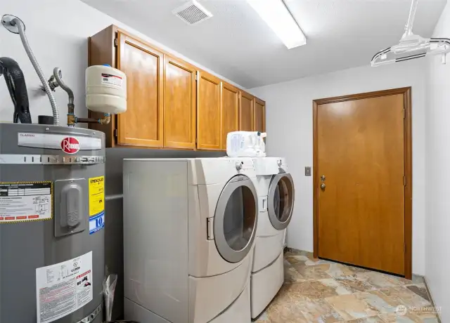 Laundry room off dining room connects to garage