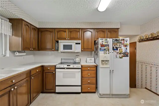 To the right of the kitchen is a storage pantry.