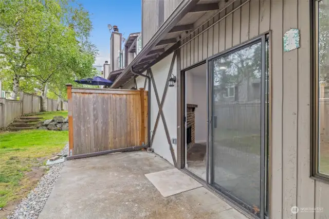 Backyard patio with privacy fence.