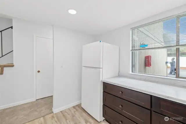 Looking towards the entry way from the kitchen.