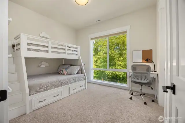 The second bedroom on the main level connects to a Jack & Jill Bathroom and has its own walk-in closet.