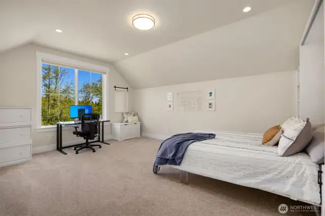 Connected to the game room is the 4th bedroom with a built-in Murphy Bed.