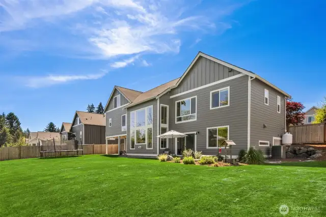 The private backyard with mature landscaping.