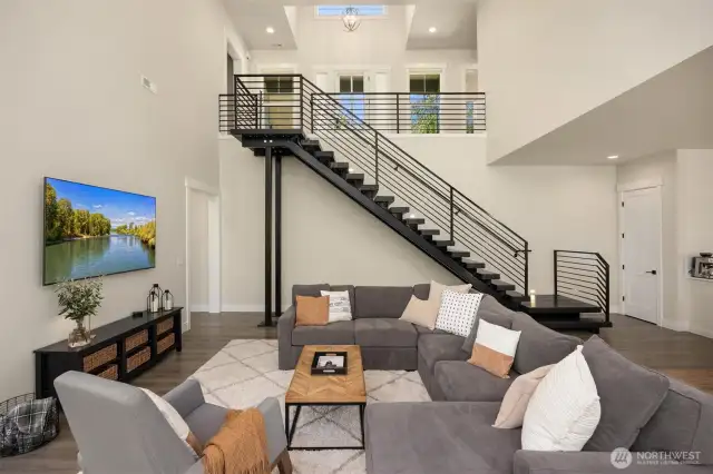 The modern staircase that leads you from the main level to the living level.